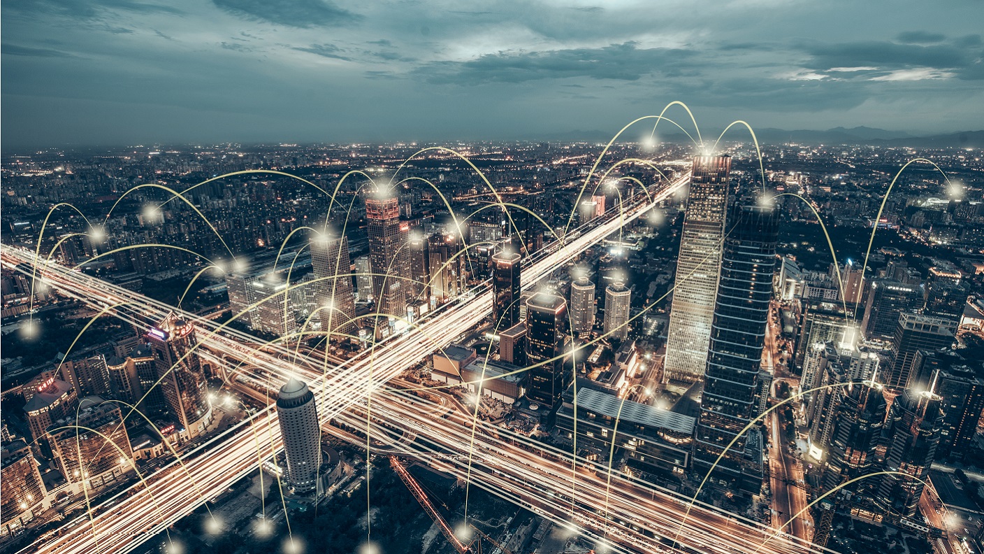 A busy city scene with interconnecting digital lines